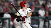 Mar 27, 2025; Phoenix, Arizona, USA; Arizona Diamondbacks outfielder Jake McCarthy (31) hits a sacrifice fly RBI against the Chicago Cubs during the sixth inning at Chase Field. Mandatory Credit: Joe Camporeale-Imagn Images