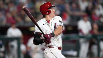 Mar 27, 2025; Phoenix, Arizona, USA; Arizona Diamondbacks outfielder Jake McCarthy (31) hits a sacrifice fly RBI against the Chicago Cubs during the sixth inning at Chase Field. Mandatory Credit: Joe Camporeale-Imagn Images