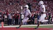 Penn State safety Jaylen Reed returns an interception for a touchdown against Wisconsin. The undefeated Nittany Lions host Ohio State in the game of the week.