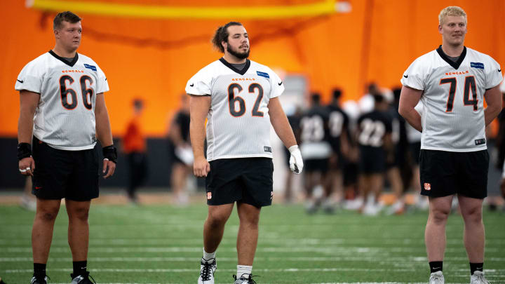 Cincinnati Bengals center Nate Gilliam (66), Cincinnati Bengals center Matt Lee (62) and Cincinnati Bengals offensive tackle Eric Miller (74) look on at Bengals spring practice at the IEL Indoor Facility in Cincinnati on Thursday, June 13, 2024.