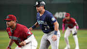 Jun 10, 2025; Phoenix, Arizona, USA; Seattle Mariners catcher Cal Raleigh (29) leads off first base as Arizona Diamondbacks first base Josh Naylor (22) covers the bag during the first inning at Chase Field. Mandatory Credit: Joe Camporeale-Imagn Images