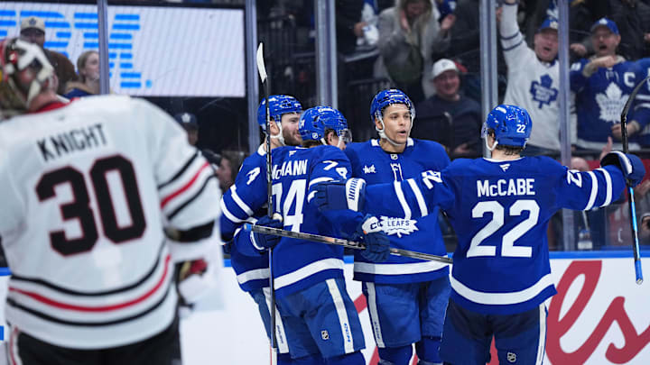 Dec 16, 2025; Toronto, Ontario, CAN; Toronto Maple Leafs center Dakota Joshua (81) scores a goal and celebrates with defenseman Jake McCabe (22) against the Chicago Blackhawks during the third period at Scotiabank Arena. Mandatory Credit: Nick Turchiaro-Imagn Images