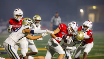 Chaminade-Madonna's Jensen Lopez, who had 10 catches for 114 yards, fights for a first down against the St. John Bosco defense. It was a heavyweight showdown between two Top 10 teams. Here is what we learned from the game.