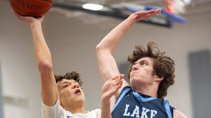 Wynford's Anthony Evans puts up a shot over Lake's Travis Merrill. Wynford's Anthony Evans puts up a shot over Lake's Travis Merrill.