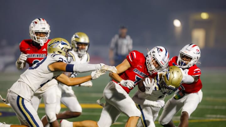 Chaminade Madonna wide receiver Jansen Lopez running against St. John Bosco’s defense.