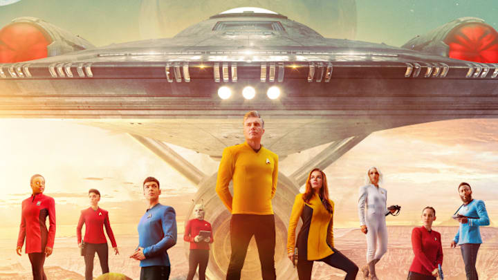Pictured: (L-R) Celia Rose Gooding as Uhura, Melissa Navia as Ortegas, Ethan Peck as Spock, Bruce Horak as Hemmer, Anson Mount as Pike, Rebecca Romijn as Una, Jess Bush as Chapel, Christina Chong as La’an and Baby Olusanmokun as M’Benga in the official key art of the Paramount+ original series STAR TREK: STRANGE NEW WORLDS. Photo Cr: James Dimmock/Paramount+ ©2022 ViacomCBS. All Rights Reserved.