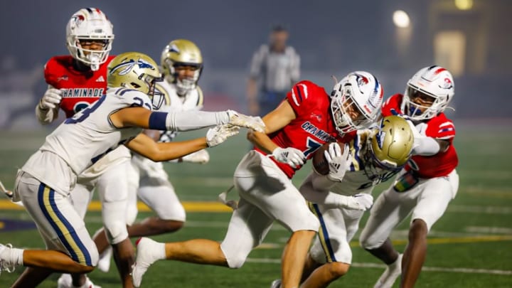 Chaminade Madonna wide receiver Jansen Lopez running against St. John Bosco’s defense 