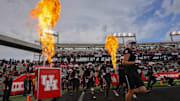 Nov 1, 2025; Houston, Texas, USA; The Houston Cougars run out onto the field before playing against the West Virginia Mountaineers at TDECU Stadium. Mandatory Credit: Thomas Shea-Imagn Images