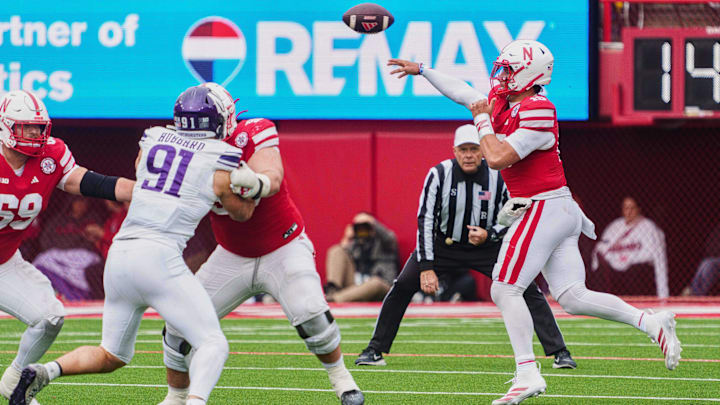 Oct 25, 2025; Lincoln, Nebraska, USA; Nebraska Cornhuskers quarterback Dylan Raiola (15) throws a pass against Northwestern Wildcats defensive lineman Aidan Hubbard (91) during the fourth quarter at Memorial Stadium. Mandatory Credit: Dylan Widger-Imagn Images