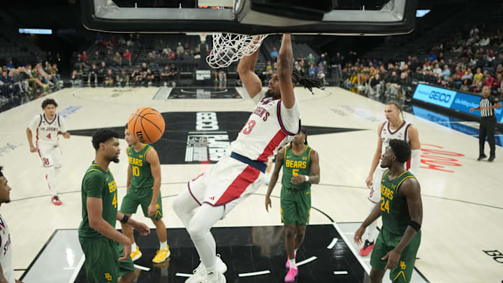 St. John's Red Storm forward Bryce Hopkins (23) dunks the ball against the Baylor Bears in a 2025 Players Era Festival group play game at Michelob Ultra Arena