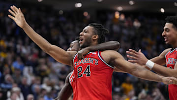 Mar 8, 2025; Milwaukee, Wisconsin, USA;  St. John’s basketball forward Zuby Ejiofor (24) celebrates after making the game winning shot in overtime against the Marquette Golden Eagles at Fiserv Forum.