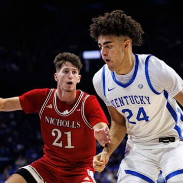 Nov 4, 2025; Lexington, Kentucky, USA; Kentucky Wildcats center Malachi Moreno (24) drives to the basket around Nicholls Colonels guard Nick Krass (21) during the second half at Rupp Arena at Central Bank Center. Mandatory Credit: Jordan Prather-Imagn Images