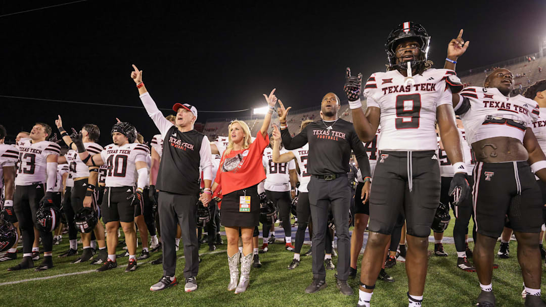 Oct 4, 2025; Houston, Texas, USA; Texas Tech Raiders head coach Joey McGuire and his wife Debbie McGuire sing the school song with the teams players after they defeated the Houston Cougars at TDECU Stadium. Mandatory Credit: Thomas Shea-Imagn Images