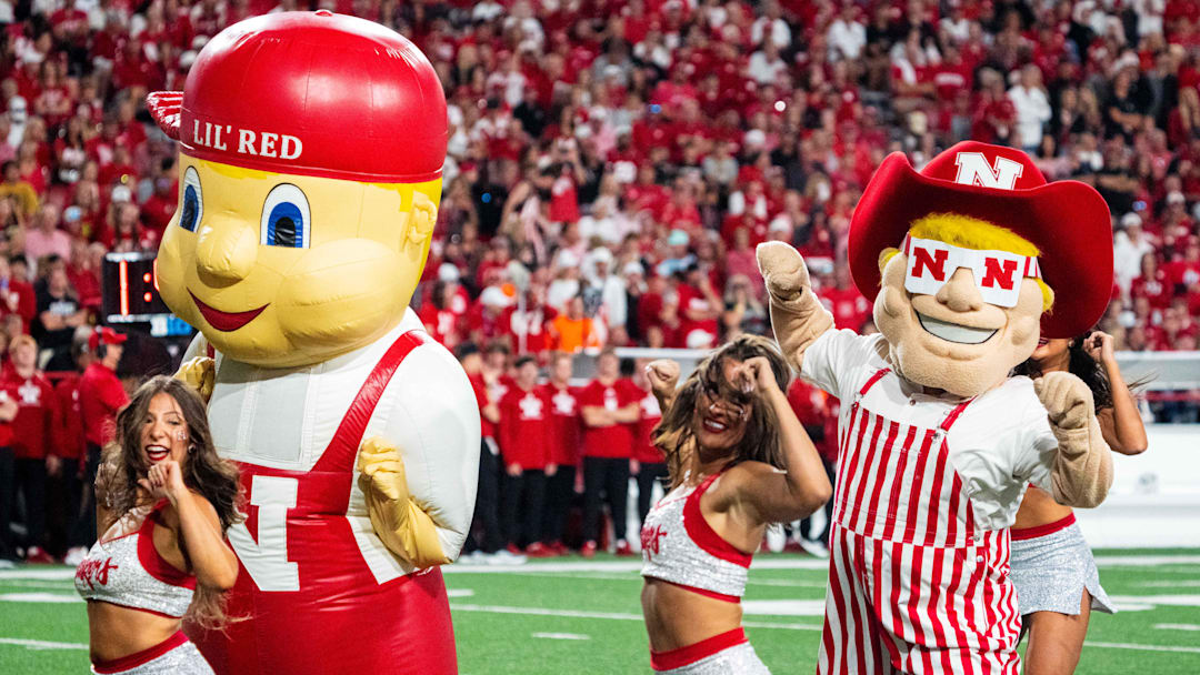 Sep 7, 2024; Lincoln, Nebraska, USA; Lil’ Red and Herbie Husker perform with the Scarletts during the third quarter between the Nebraska Cornhuskers and the Colorado Buffaloes at Memorial Stadium. 