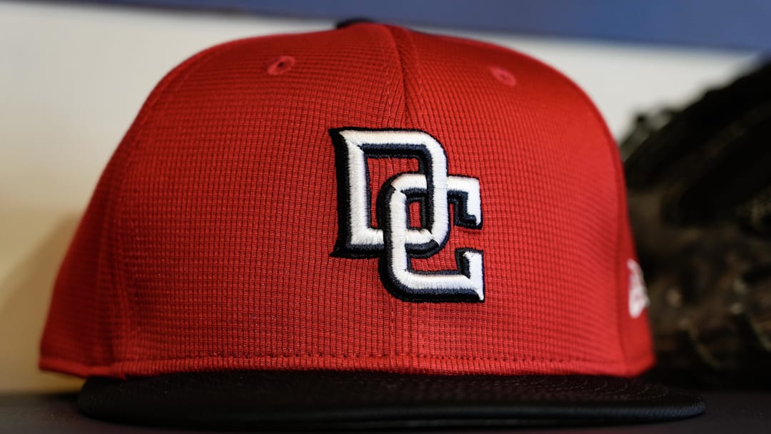Jul 11, 2025; Milwaukee, Wisconsin, USA;  General view of a Washington Nationals cap in the dugout during batting practice prior to the game against the Milwaukee Brewers at American Family Field. Mandatory Credit: Jeff Hanisch-Imagn Images