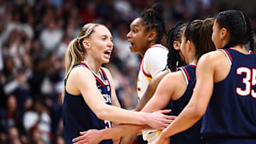 Bueckers (left) scored 31 points against USC on Monday, and heads to the Final Four having scored at least 30 points in three straight games.