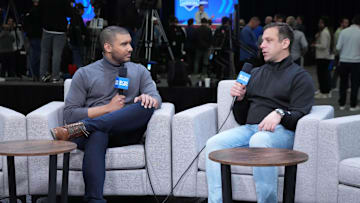 Feb 27, 2024; Indianapolis, IN, USA; CBS Sports lead insider reporter Jonathan Jones (left) interviews Kansas City Chiefs general manager Brett Veach during the NFL Scouting Combine at Indiana Convention Center. Mandatory Credit: Kirby Lee-Imagn Images
