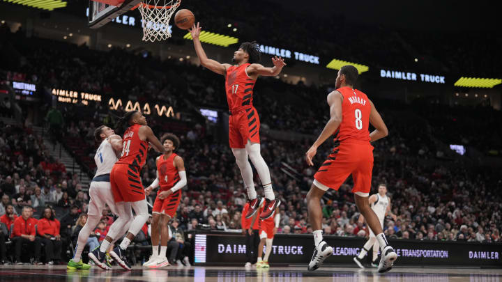 Dec 8, 2023; Portland, Oregon, USA; Portland Trail Blazers shooting guard Shaedon Sharpe (17) grabs a rebound during the second half against the Dallas Mavericks at Moda Center. Mandatory Credit: Soobum Im-USA TODAY Sports