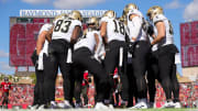 Dec 31, 2023; Tampa, Florida, USA;  New Orleans Saints quarterback Derek Carr (4) leads a huddle