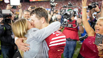 San Francisco 49ers quarterback Brock Purdy kisses his fiancee Jenna Brandt after winning the NFC Championship against the Detroit Lions at Levi's Stadium. 