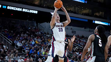 Mar 20, 2025; Wichita, KS, USA; Gonzaga Bulldogs forward Ben Gregg (33) shoots against Georgia Bulldogs guard Silas Demary Jr. (5) in the second half of a first round men’s NCAA Tournament game at Intrust Bank Arena. Mandatory Credit: Kirby Lee-Imagn Images