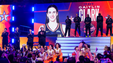 Team WNBA guard Caitlin Clark waves to fans after being announced in introductions during the WNBA All-Star Game at Footprint Center in Phoenix on July 20, 2024.