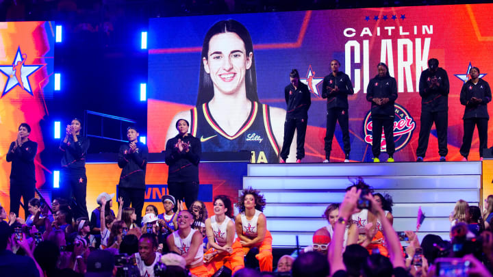 Team WNBA guard Caitlin Clark waves to fans after being announced in introductions during the WNBA All-Star Game at Footprint Center in Phoenix on July 20, 2024.