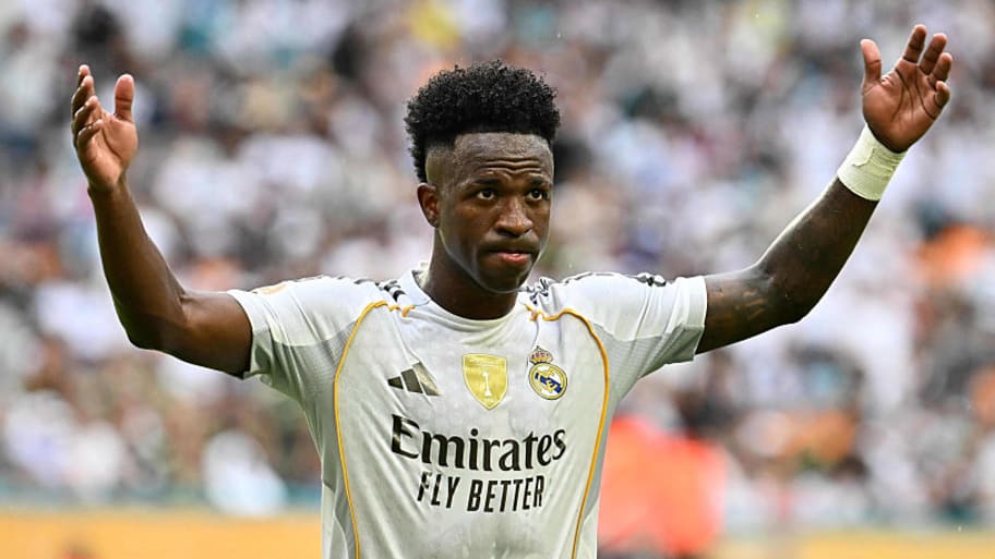 Vinicius Junior with arms raised.