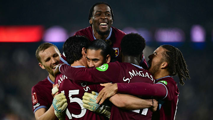 West Ham players rejoice after beating Brentford in penalties to advance to the next round of the FA Cup. 