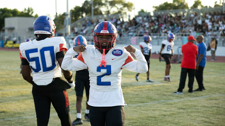 Gardena Serra's Devohn Moutra Jr. flexes for the camera before the Cavs take on Hamilton High.