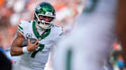 New York Jets quarterback Justin Fields (7) scrambles before running the ball in for a two point conversion in the fourth quarter of the NFL Week 8 game between the Cincinnati Bengals and the New York Jets at Paycor Stadium in downtown Cincinnati on Sunday, Oct. 26, 2025. The Bengals lost 39-38, giving the Jets their first win of the season.