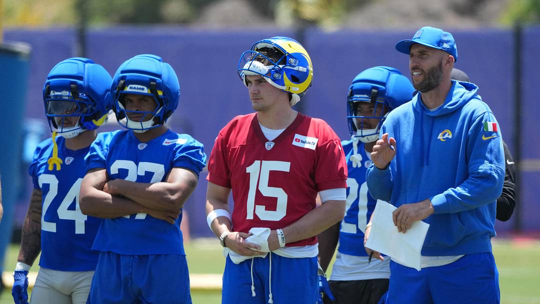 Jun 2, 2026; Woodland Hills, CA, USA; Los Angeles Rams running backs Blake Corum (24), Jarquez Hunter (27), quarterback Ty Simpson (15) and quarterbacks coach Dave Ragone watch during organized team activities at Rams Practice Facility. Mandatory Credit: Kirby Lee-Imagn Images