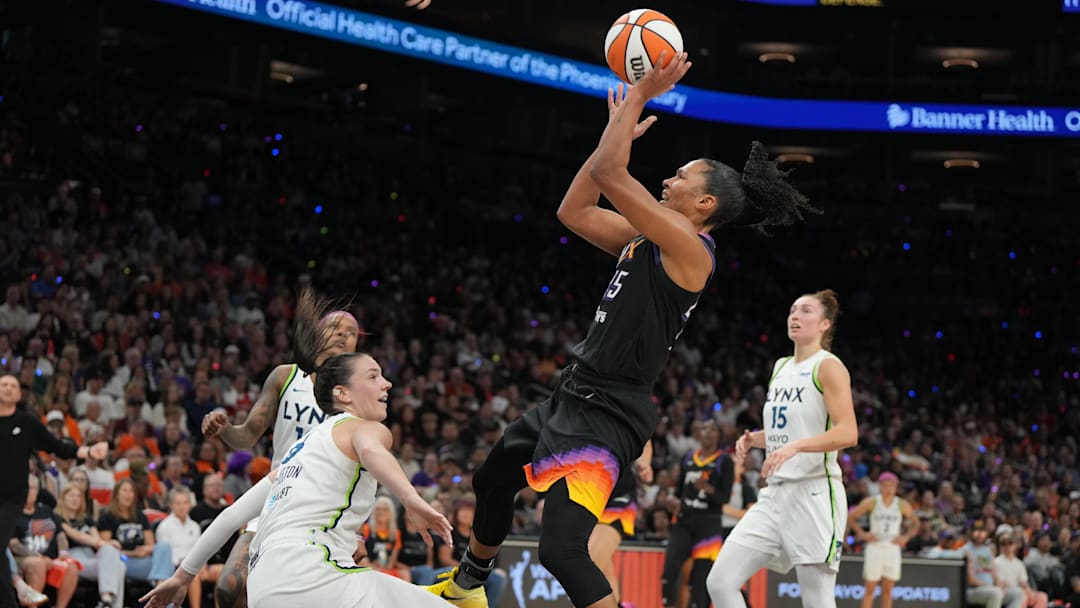 Sep 28, 2025; Phoenix, Arizona, USA; Phoenix Mercury forward Alyssa Thomas (25) shoots over Minnesota Lynx forward Bridget Carleton (6) in the first half during game four of the second round for the 2025 WNBA Playoffs at PHX Arena. Mandatory Credit: Rick Scuteri-Imagn Images