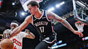 Oct 17, 2025; Toronto, Ontario, CAN; Brooklyn Nets forward Michael Porter Jr. (17) and Toronto Raptors guard Ja'Kobe Walter (14) battle for the ball during the third quarter  at Scotiabank Arena. Mandatory Credit: Kevin Sousa-Imagn Images