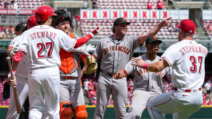 San Francisco Giants pitcher Erik Miller (68) gestures toward the Reds bench as the dugout clears after the final out of the ninth inning of the MLB National League game between the Cincinnati Reds and the San Francisco Giants at Great American Ball Park on Thursday, April 16, 2026. The Giants won 3-0.