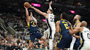 Oct 17, 2025; San Antonio, Texas, USA; Indiana Pacers guard Taelon Peter (4) shoots over San Antonio Spurs center Micah Potter (33) during the second half at Frost Bank Center. Mandatory Credit: Scott Wachter-Imagn Images
