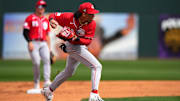 Feb. 24, 2024; Goodyear, Arizona, USA; Cincinnati Reds shortstop Edwin Arroyo fields a ground ball in the fifth inning during a MLB spring training baseball game against the Cleveland Guardians at Goodyear Ballpark. Mandatory Credit: Kareem Elgazzar-Imagn Images