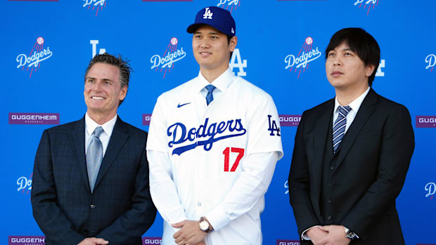 Los Angeles Dodgers player Shohei Ohtani stands with his agent Nez Balelo (left) and interpreter Ippei Mizuhara