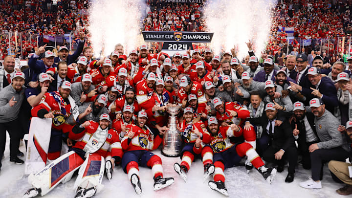 Jun 24, 2024; Sunrise, Florida, USA; The Florida Panthers pose with the cup for a team photo after winning game seven of the 2024 Stanley Cup Final against the Edmonton Oilers at Amerant Bank Arena. Mandatory Credit: Sam Navarro-Imagn Images Jun 24, 2024; Sunrise, Florida, USA; The Florida Panthers pose with the cup for a team photo after winning game seven of the 2024 Stanley Cup Final against the Edmonton Oilers at Amerant Bank Arena. Mandatory Credit: Sam Navarro-Imagn Images