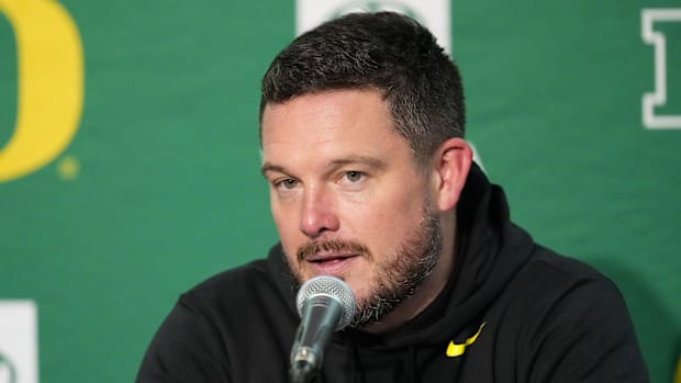 Oregon Ducks head coach Dan Lanning talks to the media during the post game press conference after the Wisconsin Badgers game