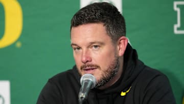 Nov 16, 2024; Madison, Wisconsin, USA;  Oregon Ducks head coach Dan Lanning talks to the media during the post game press conference following the game against the Wisconsin Badgers at Camp Randall Stadium. Mandatory Credit: Jeff Hanisch-Imagn Images