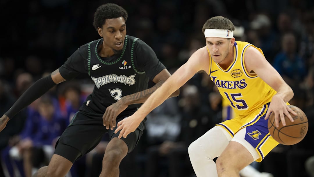 Oct 29, 2025; Minneapolis, Minnesota, USA; Los Angeles Lakers guard Austin Reaves (15) dribbles the ball as Minnesota Timberwolves forward Jaden McDaniels (3) plays defense in the first half at Target Center. Mandatory Credit: Jesse Johnson-Imagn Images Oct 29, 2025; Minneapolis, Minnesota, USA; Los Angeles Lakers guard Austin Reaves (15) dribbles the ball as Minnesota Timberwolves forward Jaden McDaniels (3) plays defense in the first half at Target Center. Mandatory Credit: Jesse Johnson-Imagn Images