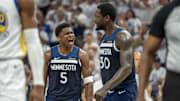 May 14, 2025; Minneapolis, Minnesota, USA; Minnesota Timberwolves guard Anthony Edwards (5) celebrates with Minnesota Timberwolves forward Julius Randle (30) after making a shot against the Golden State Warriors in the first half during game five of the second round for the 2025 NBA Playoffs at Target Center. Mandatory Credit: Jesse Johnson-Imagn Images