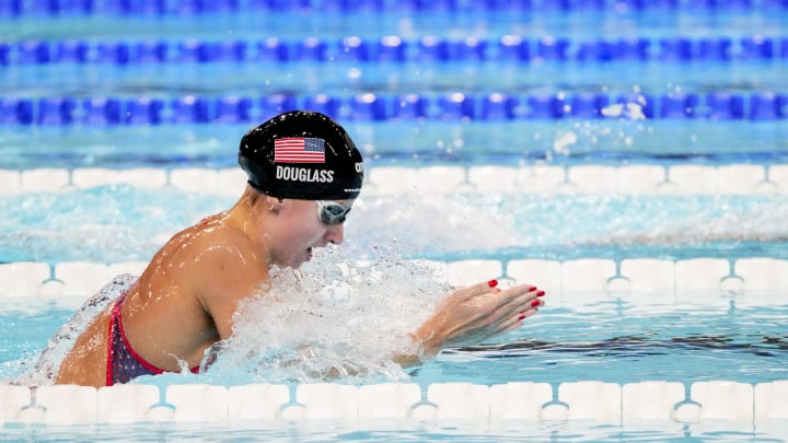 Virginia swimming legend Kate Douglass won her first-ever Olympic gold medal, holding off defending Olympic Champion Tatjana Smith of South Africa to win the 200-meter breaststroke.