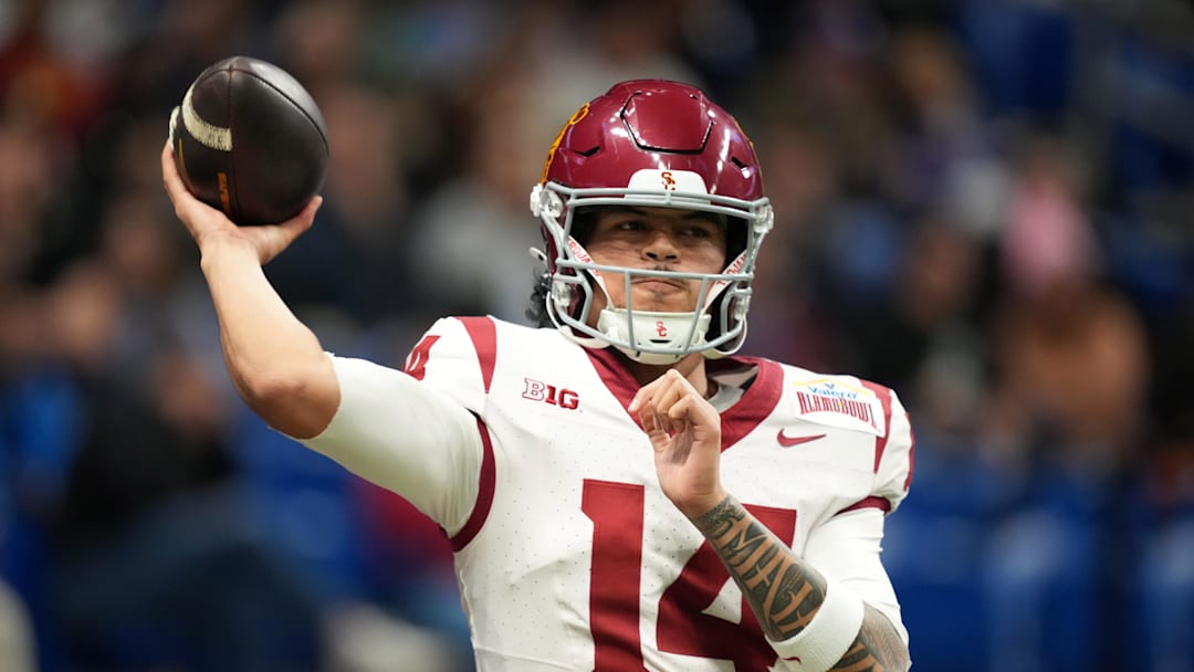 Dec 30, 2025; San Antonio, TX, USA; Southern California Trojans quarterback Jayden Maiava (14) throws the ball against the TCU Horned Frogs in the first half during the Alamo Bowl at Alamodome. 