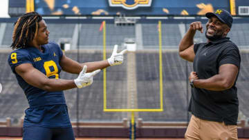 Four-star 2025 defensive lineman Nathaniel Marshall poses with Michigan head football coach Sherrone Moore in the Big House during a recruiting visit to Ann Arbor.