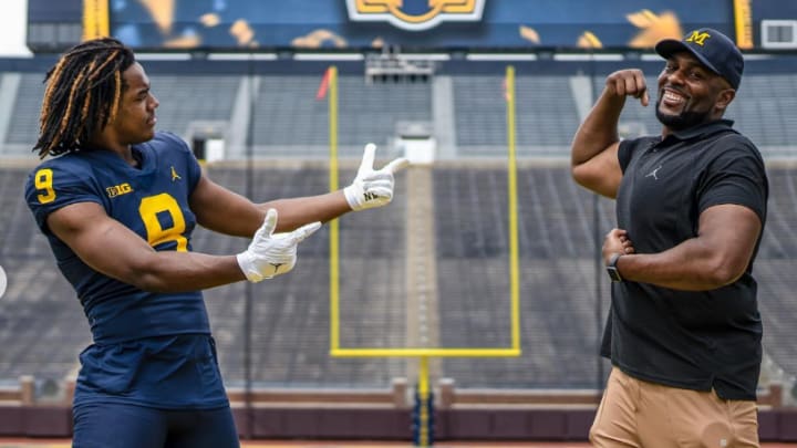 Four-star 2025 defensive lineman Nathaniel Marshall poses with Michigan head football coach Sherrone Moore in the Big House during a recruiting visit to Ann Arbor.