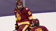 Caitlin Kramer celebrates a goal with teammate Mary Kate O'Brien in the first game of a sweep against St. Thomas