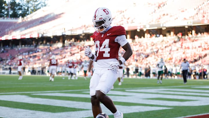 Sep 7, 2024; Stanford, California, USA; Stanford Cardinal wide receiver Ismael Cisse (84) scores a touchdown against the Cal Poly Mustangs during the second half at Stanford Stadium. Mandatory Credit: Sergio Estrada-Imagn Images