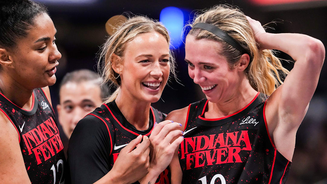 Indiana Fever forward Damiris Dantas (12), Indiana Fever guard Sophie Cunningham (8) and Indiana Fever guard Lexie Hull (10) huddle up Saturday, Aug. 9, 2025, during a game between the Indiana Fever and the Chicago Sky at Gainbridge Fieldhouse in Indianapolis.